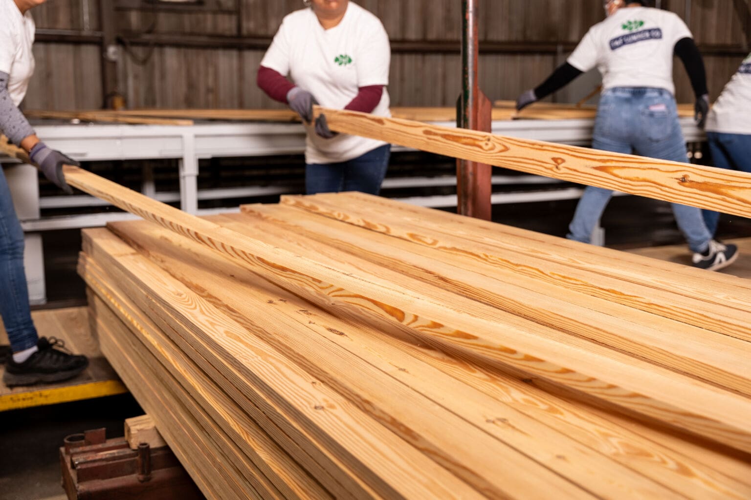 T&F Lumber team handling flooring boards