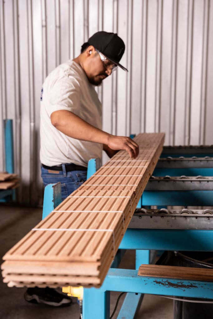 Craftsman moving milled lumber